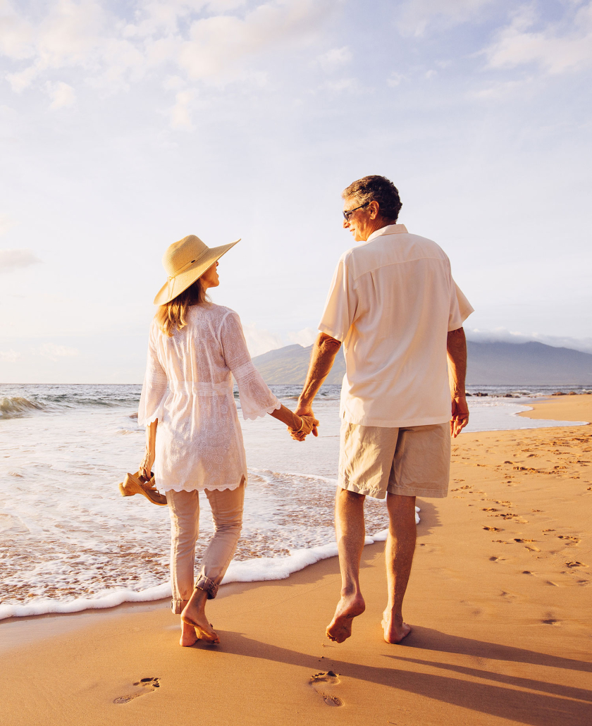 retirement financial advice-couple-walking-at-the-beach